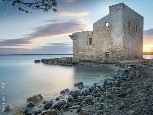 Shot of the ruins of the "Tonnara" of Vendicari at sunset. The building was used as tuna-fishing nets and it's now part of a beautiful protected natural reserve