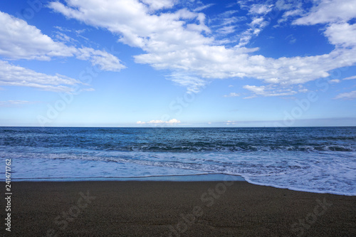 Sea view from beach with sunny sky. Summer paradise beach . Exotic summer beach with clouds on horizon. Ocean beach relax, outdoor travel -