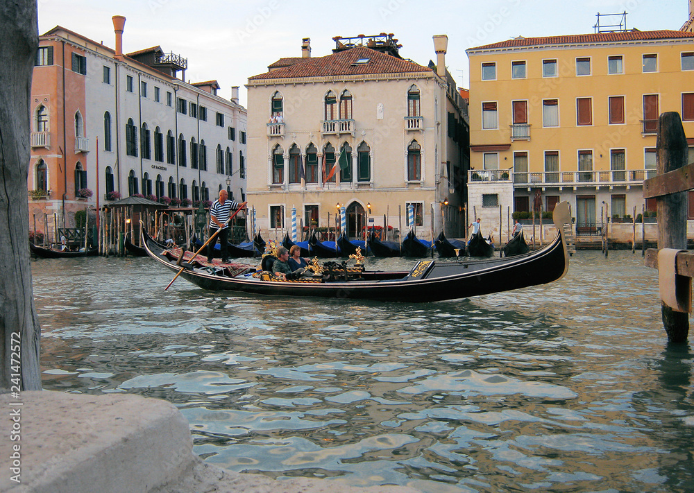 Historical buildings and romantic gondola in Venice. Italy