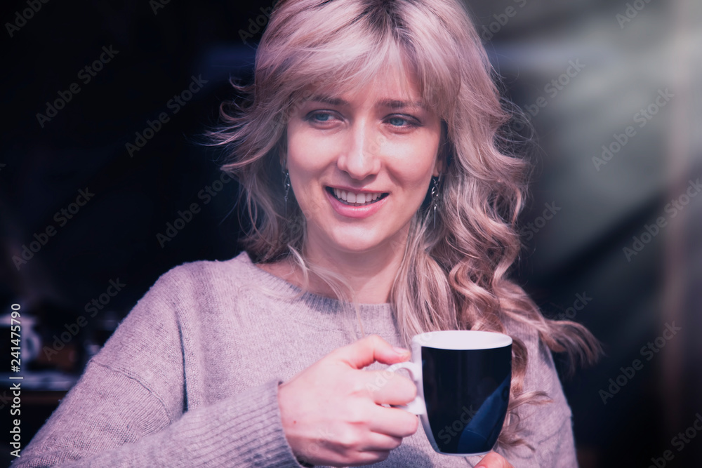 Pretty young woman drinking coffee at a sunny day Pretty young woman drinking coffee at a sunny day