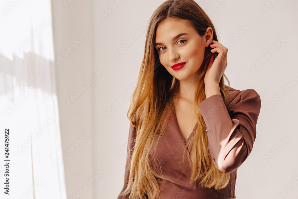 closup portrait attractive stylish young girl near the window in light interior