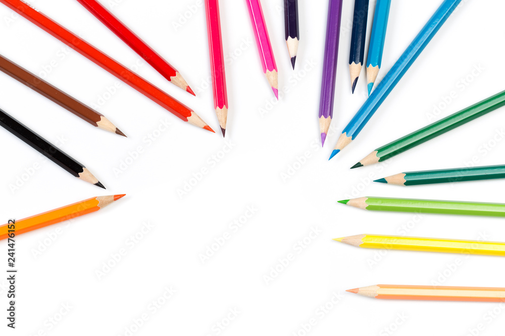 Colour pencils on white background, top view. Colour pencils on white background, top view.