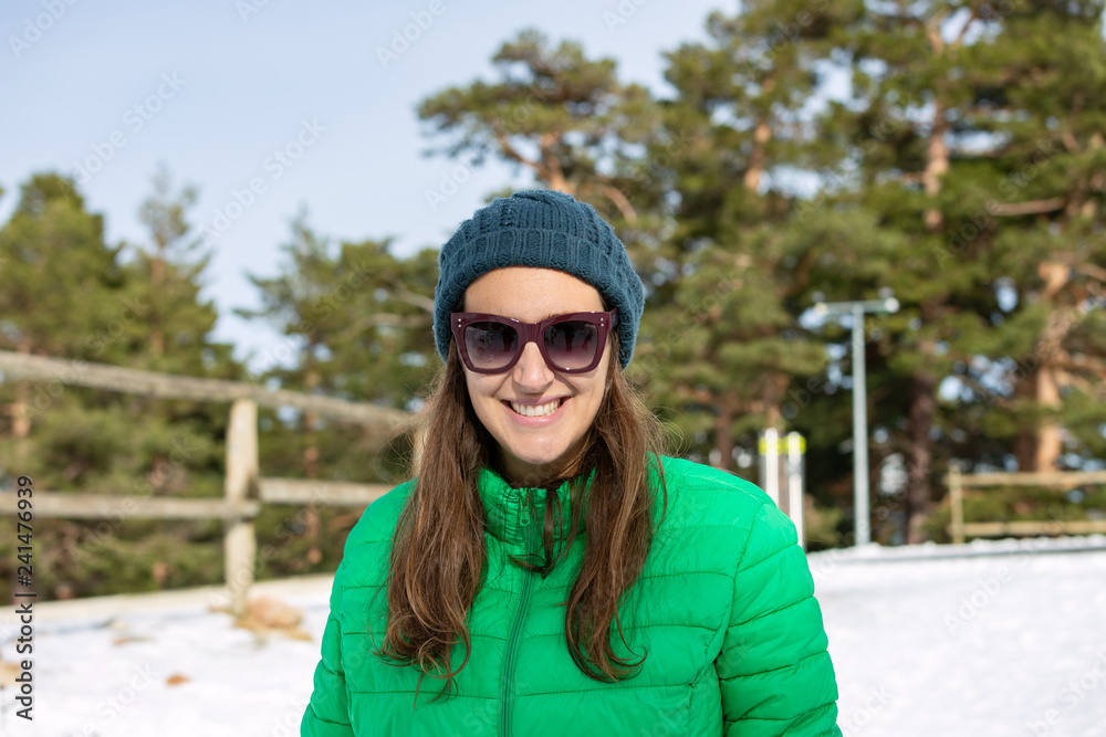 Tourist girl in vacation winter trip having fun on the arrival of European winter with her sleigh. Woman on snow mountain ridge during the months of January, February or March Tourist girl in vacation winter trip having fun on the arrival of European winter with her sleigh. Woman on snow mountain ridge during the months of January, February or March