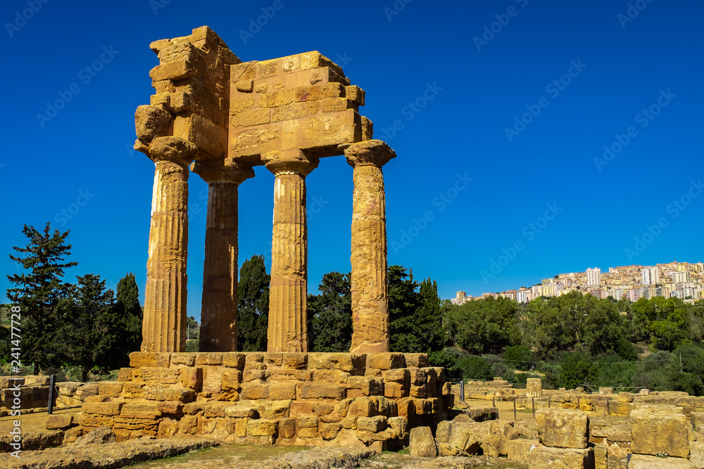 Ruins of Greek Temple of Castor and Pollux with Agrigento in the Background.