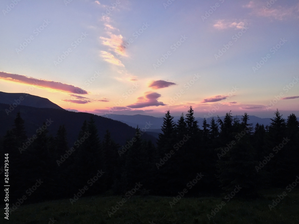 Heaven and earth in the evening sunset in the Ukrainian mountains