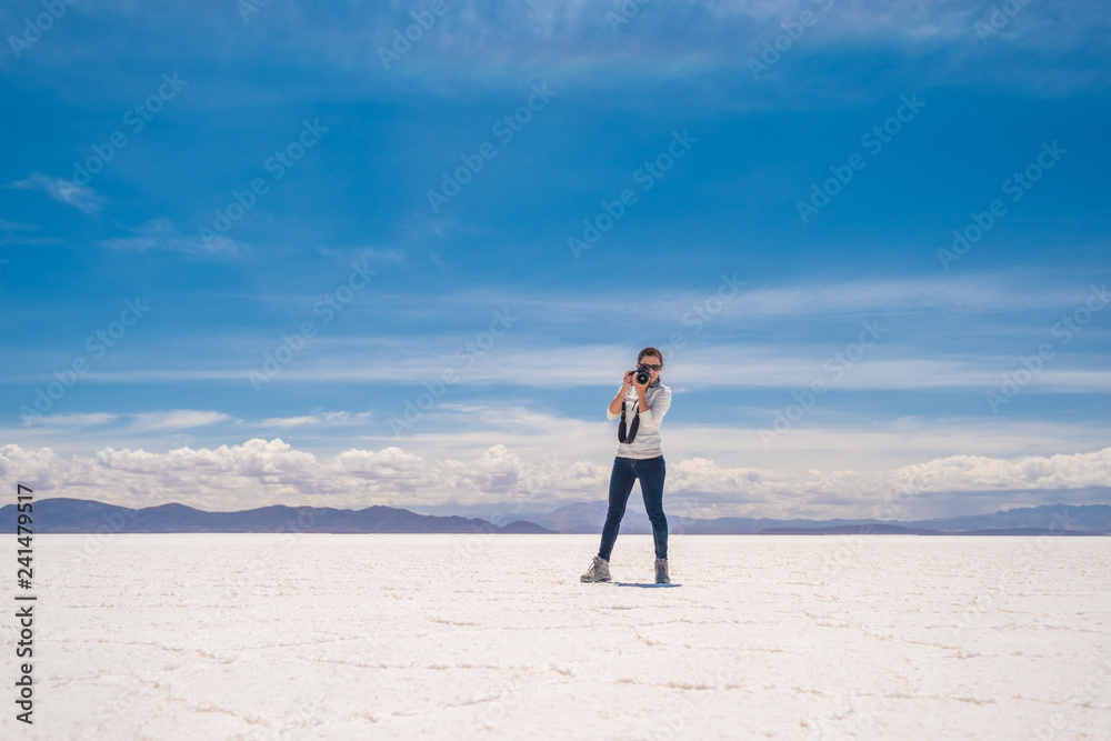 Girl taking photo in sunshine Salar de Uyuni Girl taking photo in sunshine Salar de Uyuni