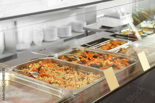 Foto Containers with healthy food in school canteen