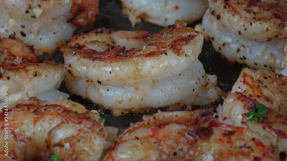 Sizzling Grilled Garlic Prawns in Frying Pan Closeup Sizzling Grilled Garlic Prawns in Frying Pan Closeup