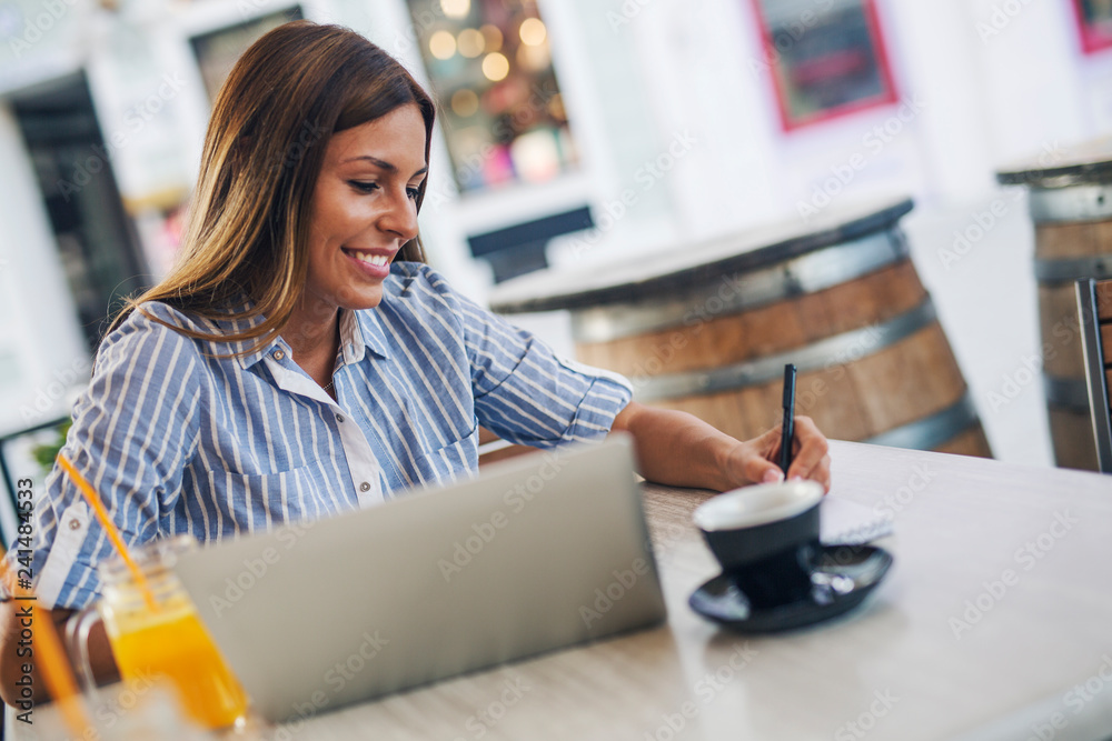 Female freelancer at cafe Female freelancer at cafe