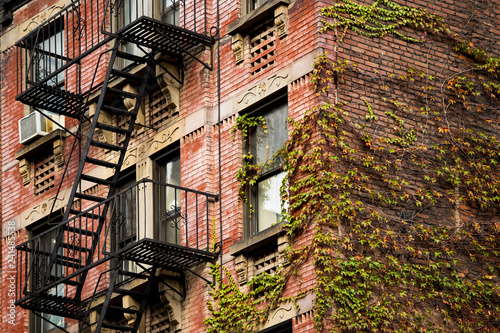 Obraz na płótnie Close-up view of New York City style apartment buildings with emergency stairs along Mott Street in Chinatown neighborhood of Manhattan, New York, United States.. w salonie