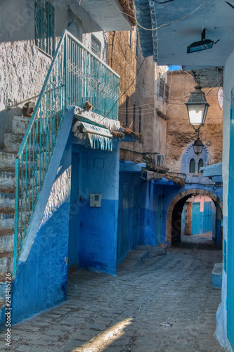 Alley with arches in Chaouen, the called blue city, a beautiful town in the north of Morocco very visited by tourists from around the world. © juanorihuela