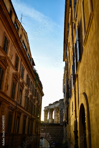 Close-up view of old Roman buildings with ancient Roman ruins in the background, Rome, Italy.