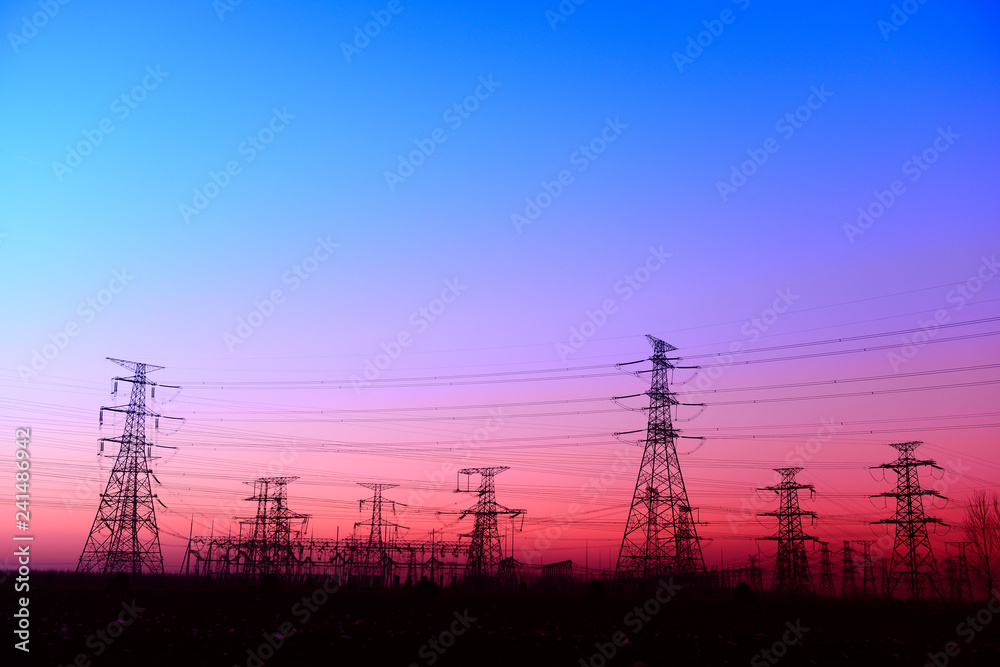 High piezoelectric towers, in the setting sun