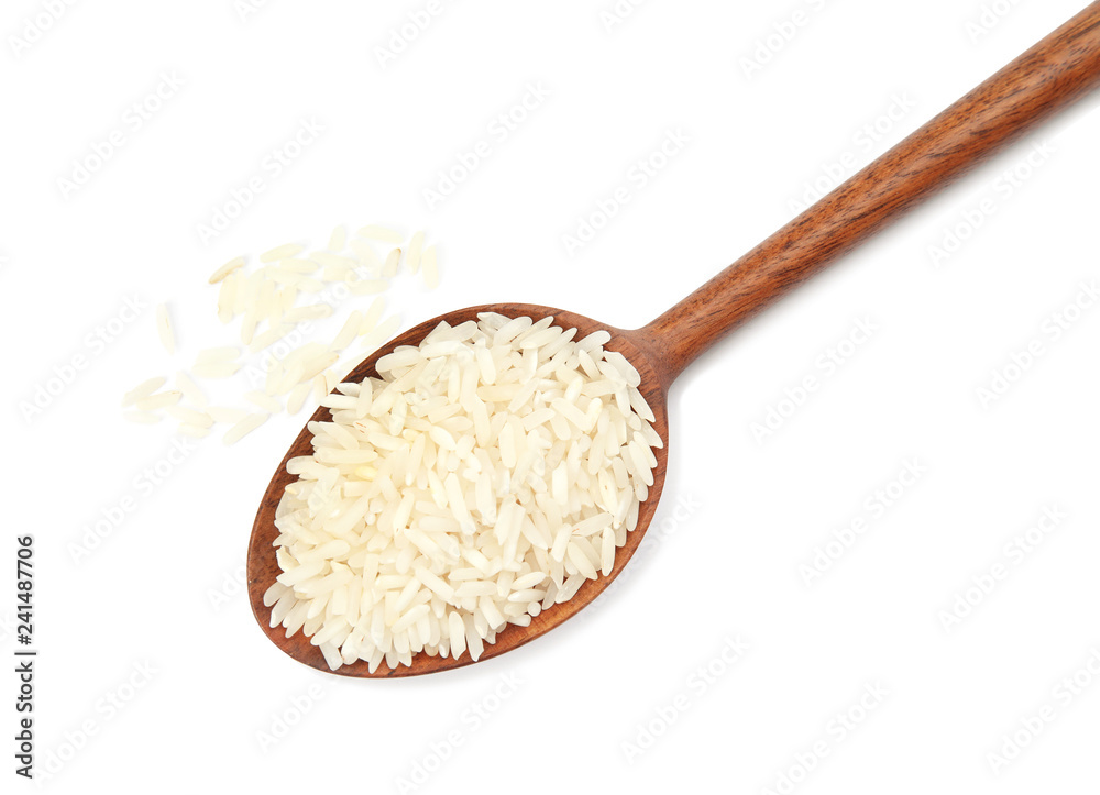 Spoon with uncooked rice on white background, top view Spoon with uncooked rice on white background, top view