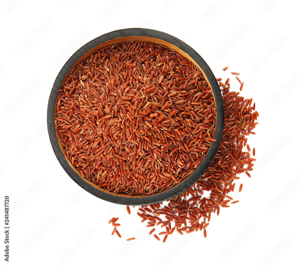 Fototapeta premium Plate with uncooked red rice on white background, top view