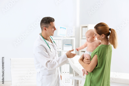 Woman with her baby visiting children's doctor in hospital