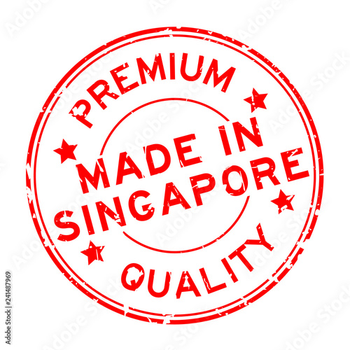 Grunge red premium quality made in Singapore round rubber business seal stamp on white background