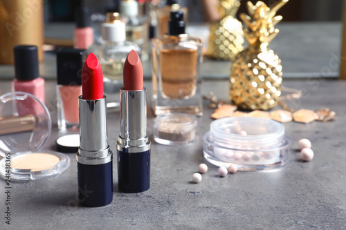 Bright lipsticks on dressing table. Decorative cosmetics