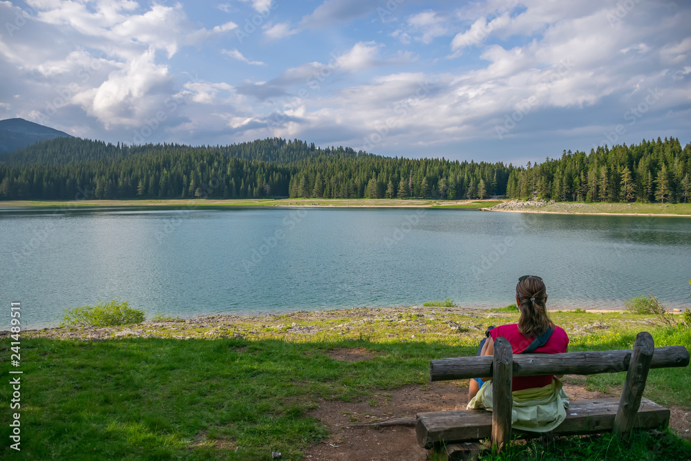 Romantic wooden benches near the Black Lake in Durmitor National Park. Montenegro Romantic wooden benches near the Black Lake in Durmitor National Park. Montenegro