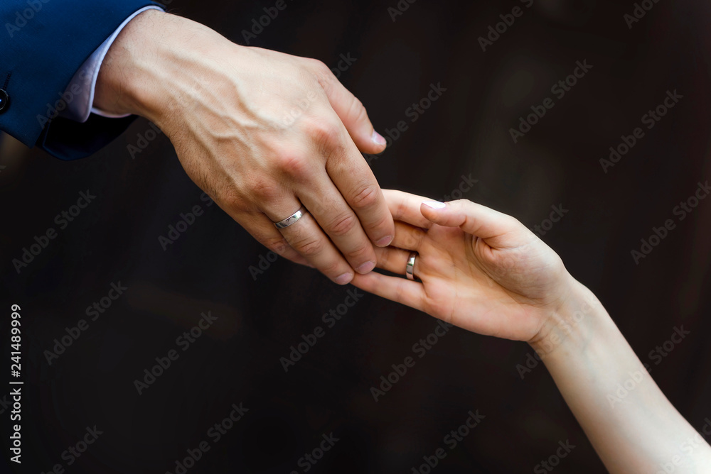 Wedding. Marriage. Hands of the bride and groom with wedding rings. Hand in hand. Love touches. Wedding rings. Wedding. Marriage. Hands of the bride and groom with wedding rings. Hand in hand. Love touches. Wedding rings.