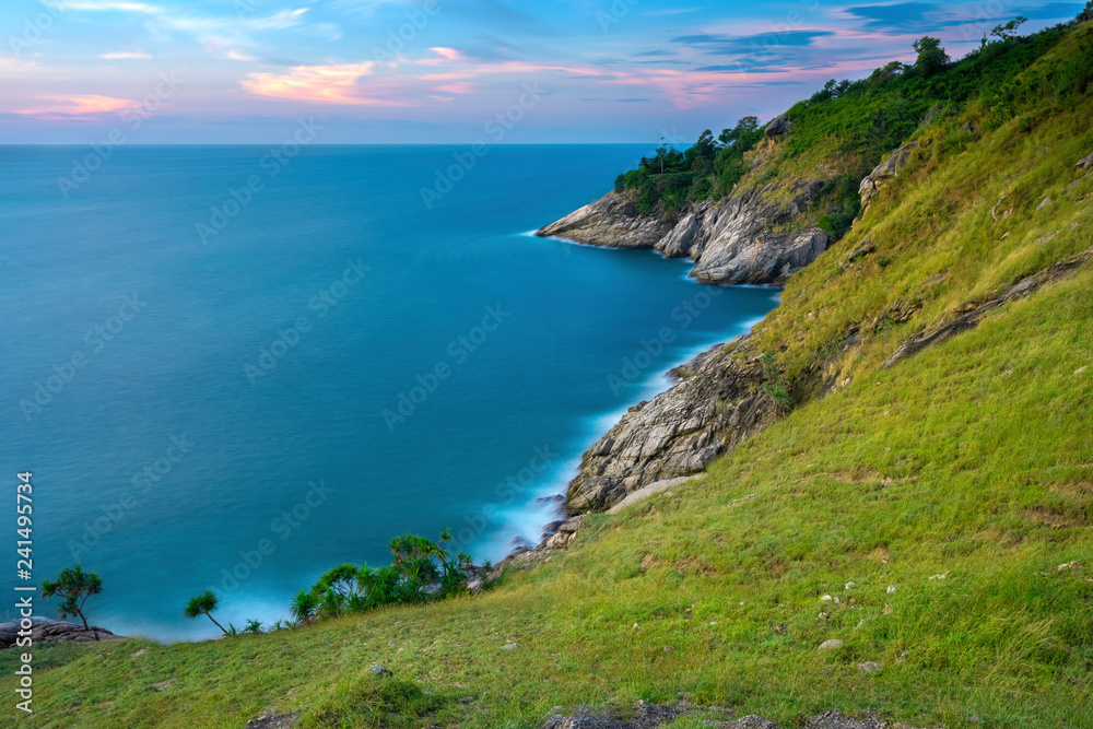 Sea and cape foreground with long exposure shot when sunset. Shot at Krating Cape, Phuket, Thailand.