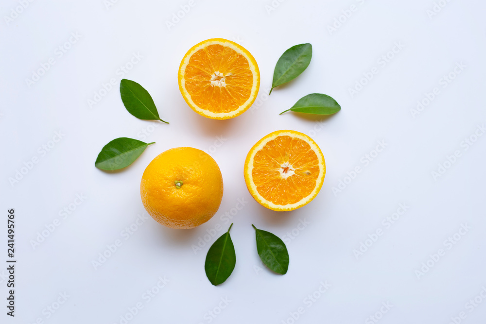 Fototapeta premium Fresh orange with green leaves on white background.
