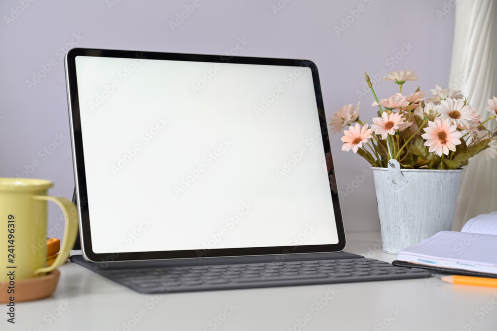 Mockup blank screen tablet with keyboard on home studio workspace Mockup blank screen tablet with keyboard on home studio workspace