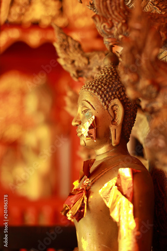 Golden buddha statue © lllonajalll