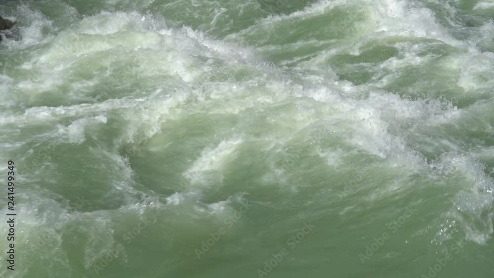 Beautiful water in a mountain river in slow motion video. Beautiful ganga river near Rishikesh, India Beautiful water in a mountain river in slow motion video. Beautiful ganga river near Rishikesh, India