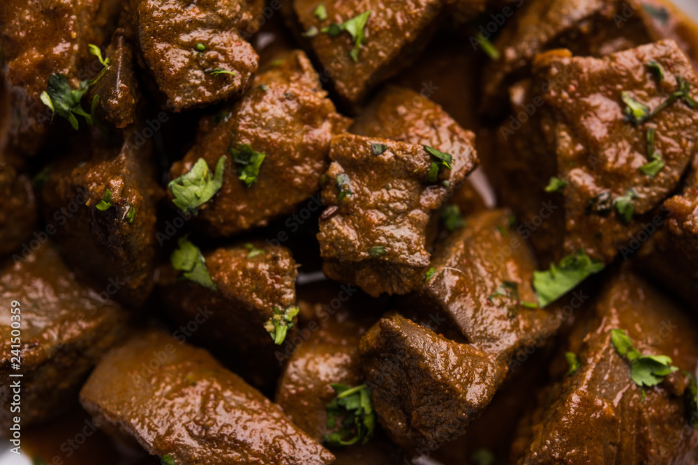 Mutton Liver fry or Kaleji masala, popular Non vegetarian recipe from India and Pakistan. served dry or with curry in a bowl, karahi or plate