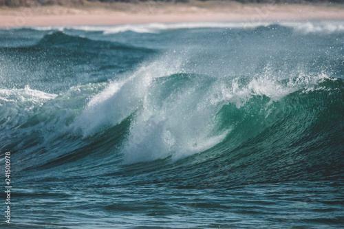 wave breaking on rocks