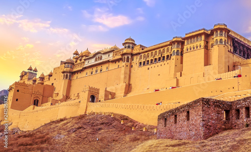 Amer Fort Jaipur Rajasthan exterior architecture with moody sunset sky. A UNESCO World Heritage site.