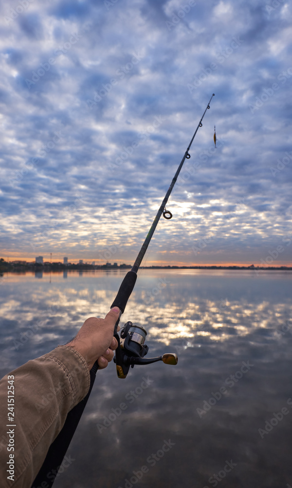 Man holding fishing rod Man holding fishing rod