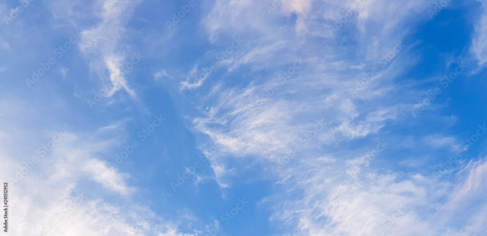 Fototapeta premium blue sky background with tiny clouds.