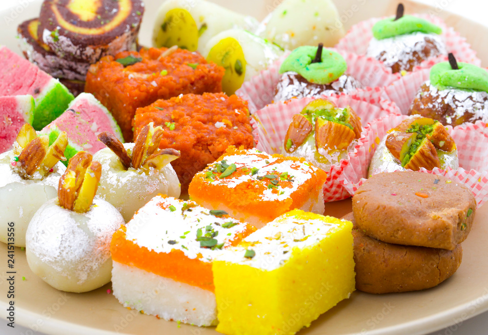 Indian Traditional Mix Sweet Food or Mix Mithai include Peda, Mawa Burfi,  Dry Fruits Sweet, Halwa or Coconut Burfi Photos | Adobe Stock
