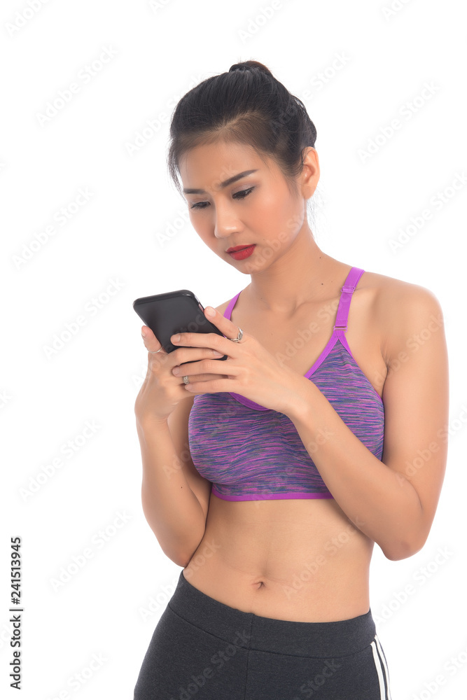 Asian young sports woman uses a smartphone. Sport girl on white background. Asian young sports woman uses a smartphone. Sport girl on white background.