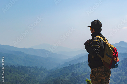 Young man hiker with backpack.