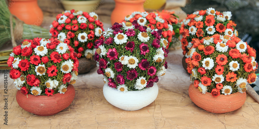 Beautiful autumn bouquet composition of dried meadow flowers with leaves, floral background.