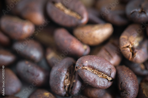 Coffee beans background texture with copy space for text. Royalty high-quality free stock macro photo image of roasted black coffee beans, coffee beans background. Close-up or macro photo coffee bean © jangnhut