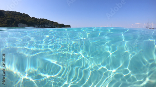 Fototapeta Naklejka Na Ścianę i Meble -  Underwater photo of mediterranean paradise island sandy beach with turquoise clear sea