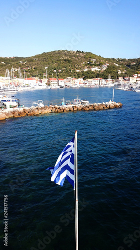 Aerial drone bird's eye view photo of iconic small safe port of Gaios with traditional Ionian architecture and sail boats docked, Paxos island, Ionian, Greece