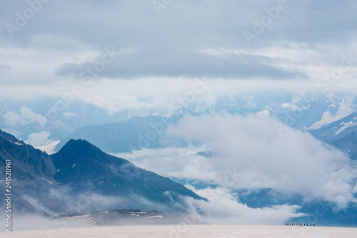 Group of brave tourists on the glacier in Caucasus mountains. Minimalistic © illustrissima