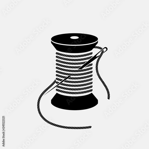 Spool of thread with needle vector icon