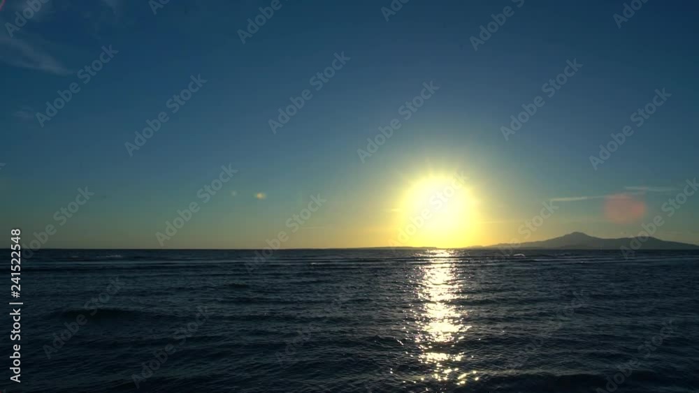 Sun casting a reflection over the ocean at sunset Sun casting a reflection over the ocean at sunset