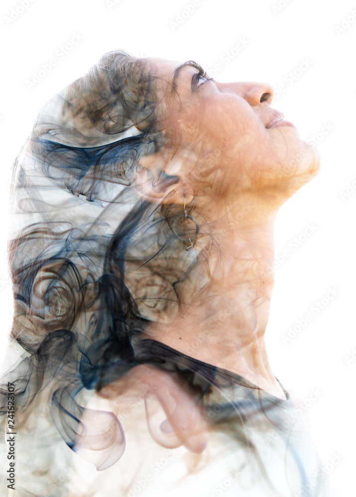 Double exposure portrait of a young exotic woman and a smoky texture ...