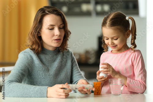 Young woman and daughter wi...