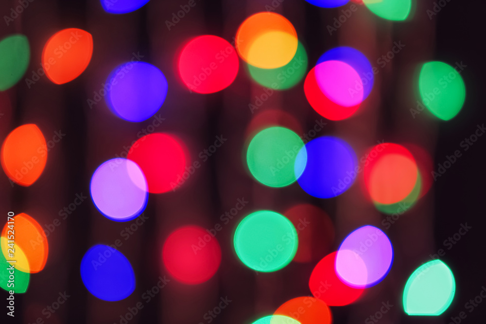 Blurred view of beautiful lights on dark background Blurred view of beautiful lights on dark background