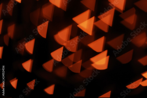 Blurred view of beautiful lights on dark background