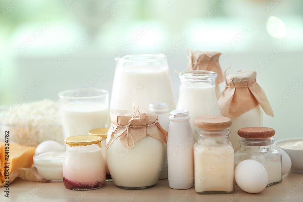 Different milk products on wooden table