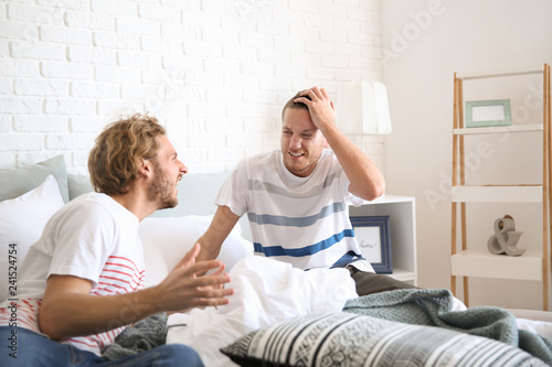 Young gay couple in quarrel...